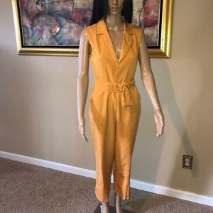 Mustard colored jumpsuit with slits